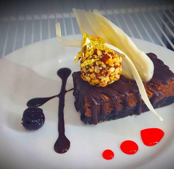 “A chocolate cheesecake with a brownie crust, garnished with a hazelnut truffle, white chocolate decorations and gold leaf. The thing I love most about this cheesecake is that not only does it have edible gold leaf, but it is also super easy to make and delicious” says Avila. 