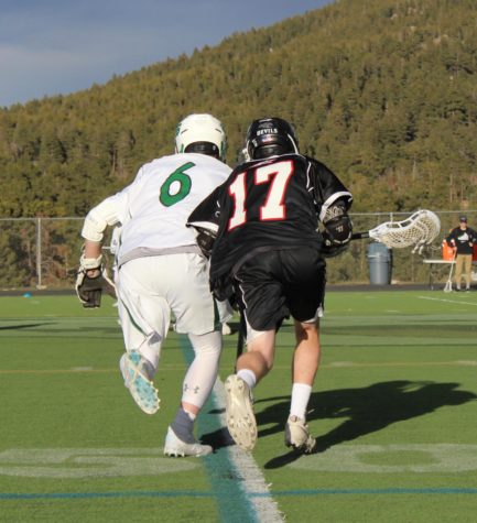 Joseph Hall 19 (#17) battles for a much needed ground ball for possession early in third quarter.