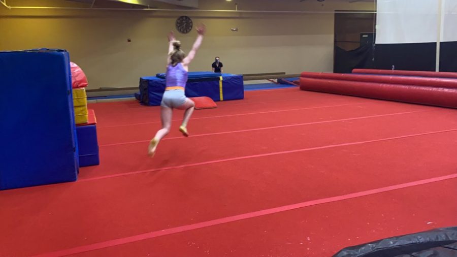 August Stovall going for her tumbling pass at practice.