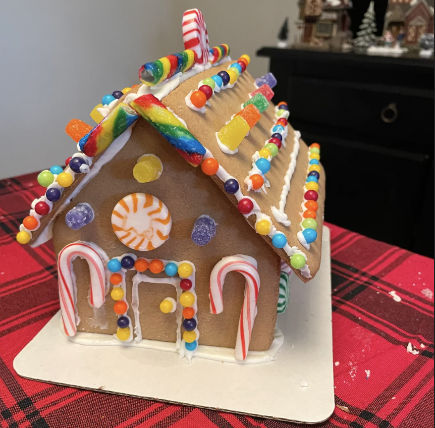 The Foster familys gingerbread house is fully detailed with gumdrops, candy canes, chocolate candies, and peppermint focal points.